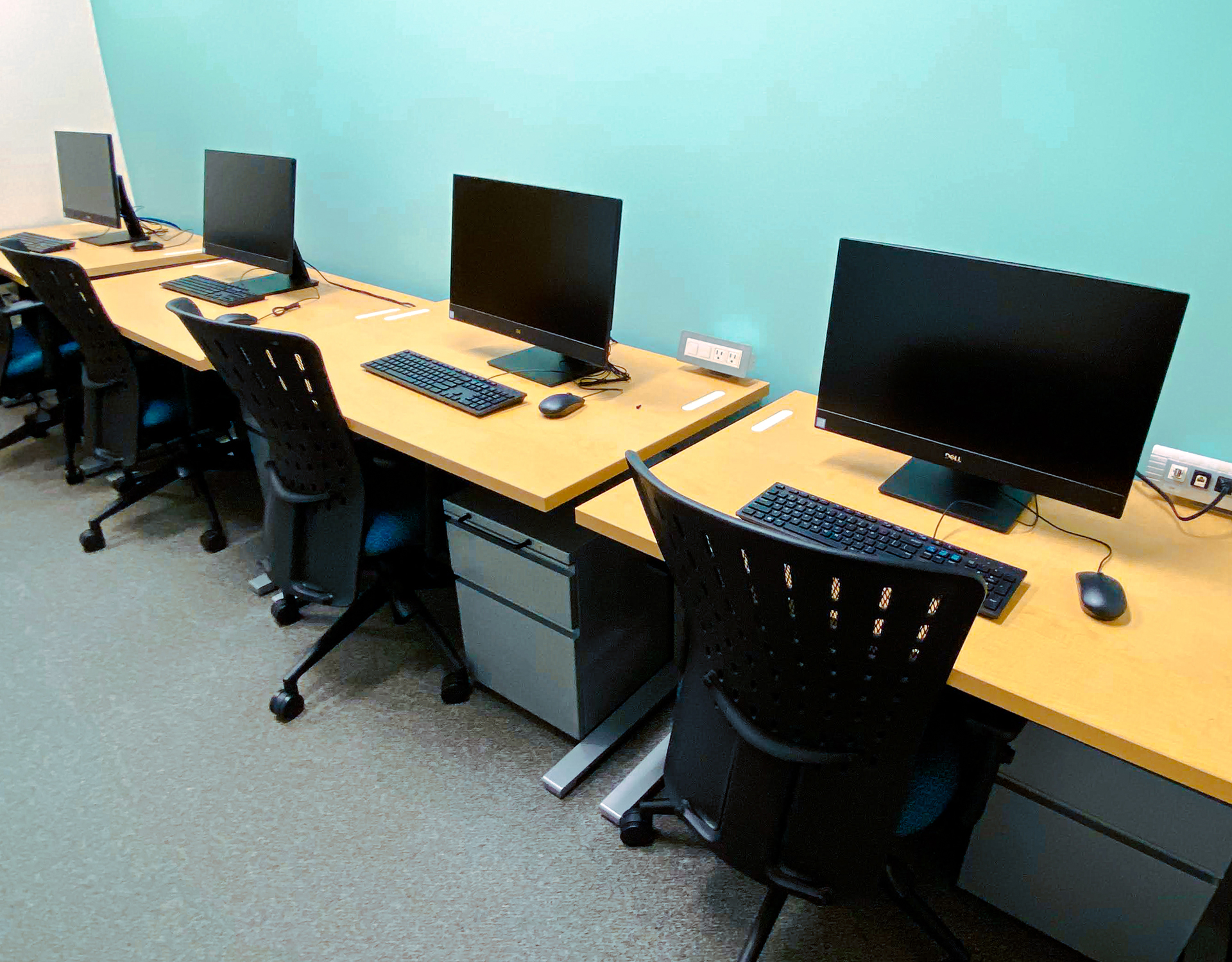 CUPE working area showing desktop computers and standing desks